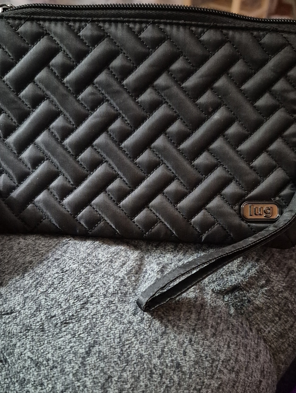 lug Black Quilted Wristlet Clutch with Logo Plate